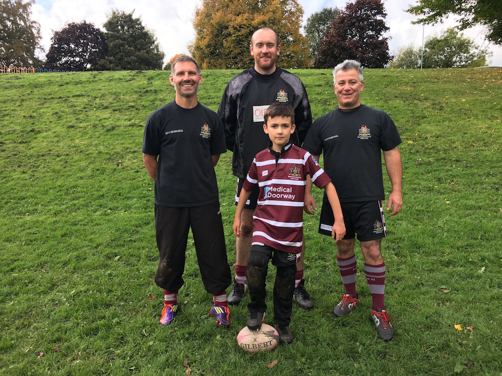 One of the Newcastle (Staffs) RUFC U9s players with coaches Kev, Mark and Jason.